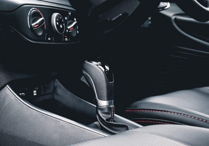 black and gray car gear shift lever
